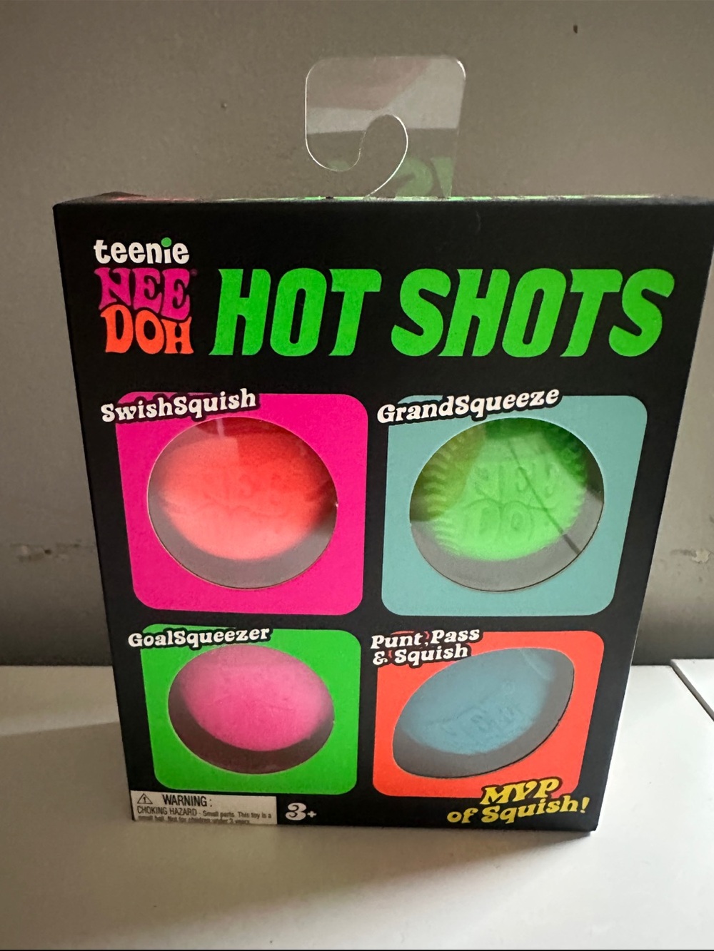 AUTHENTIC NEEDOHS Hot Shots 4-Pack Squish Toy Set - Pink, Green, Orange, Blue